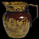 Yellow printed brown ware pitcher from a private collection